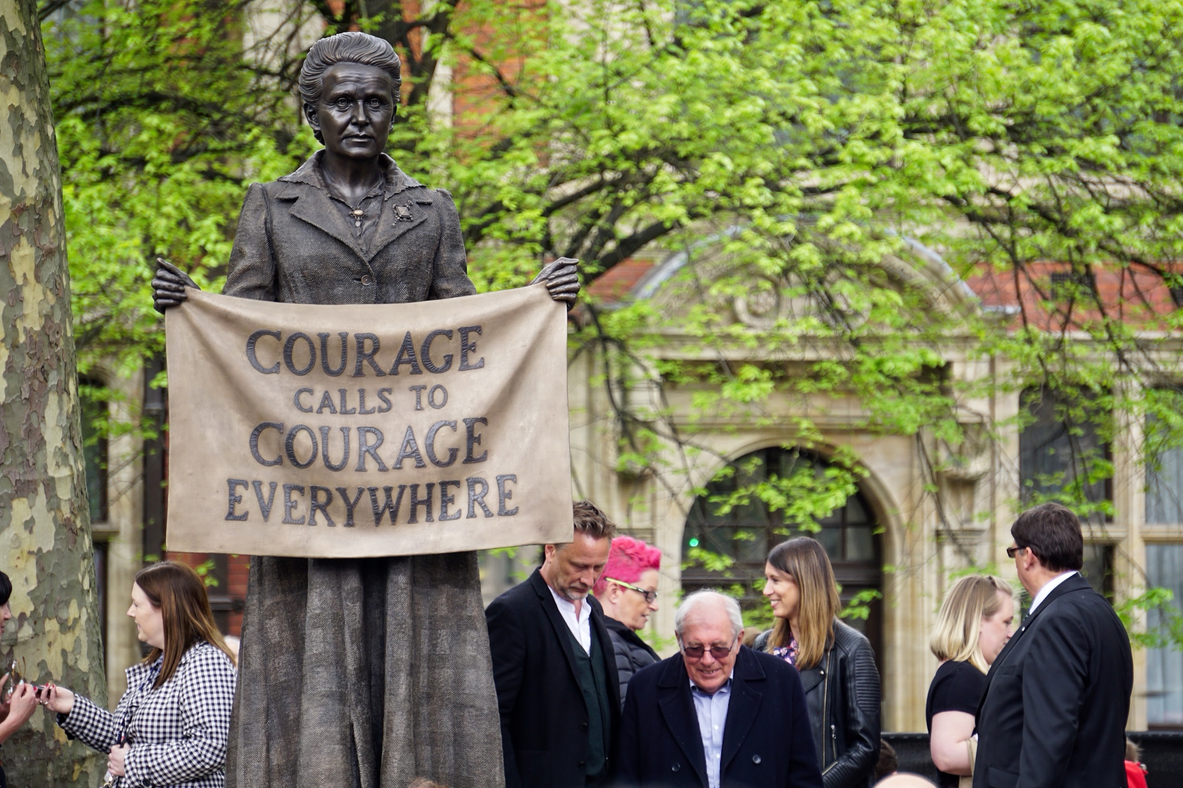 Gillian Wearing's bronze statue of Millicent Fawcett in Parliament Square, holding a banner that reads Courage calls to courage everywhere
