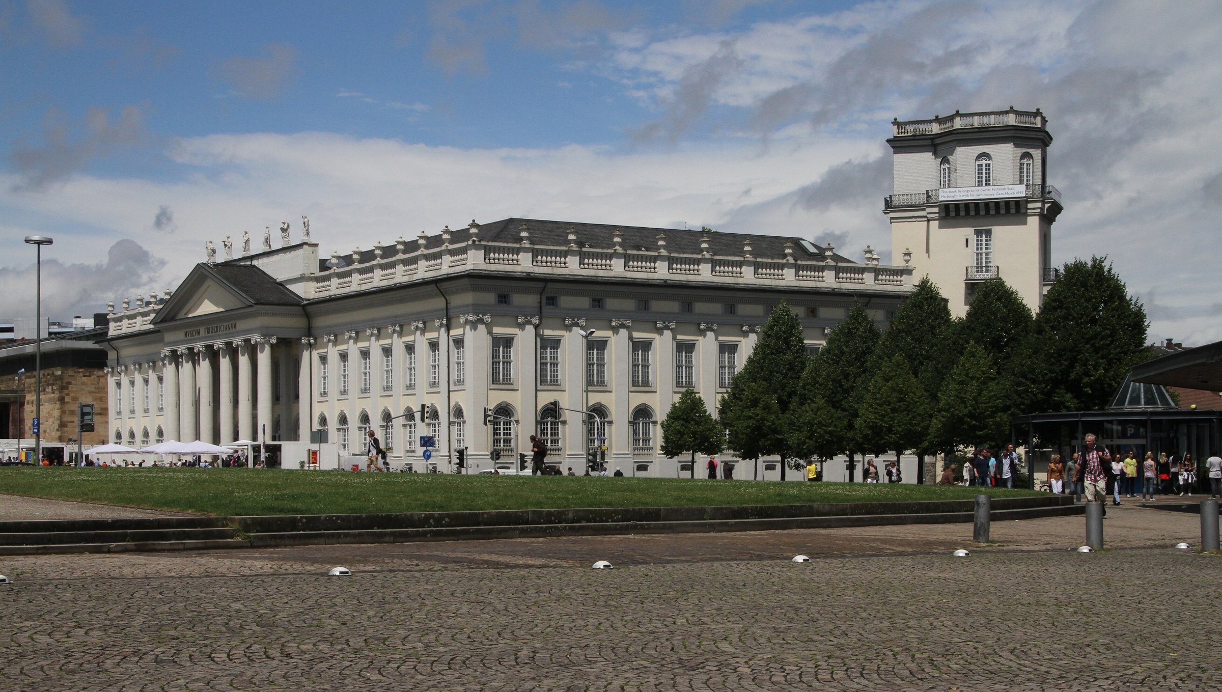 The long neoclassical front of the Fridericianum in Kassel, with its tower, seen across Friedrichsplatz