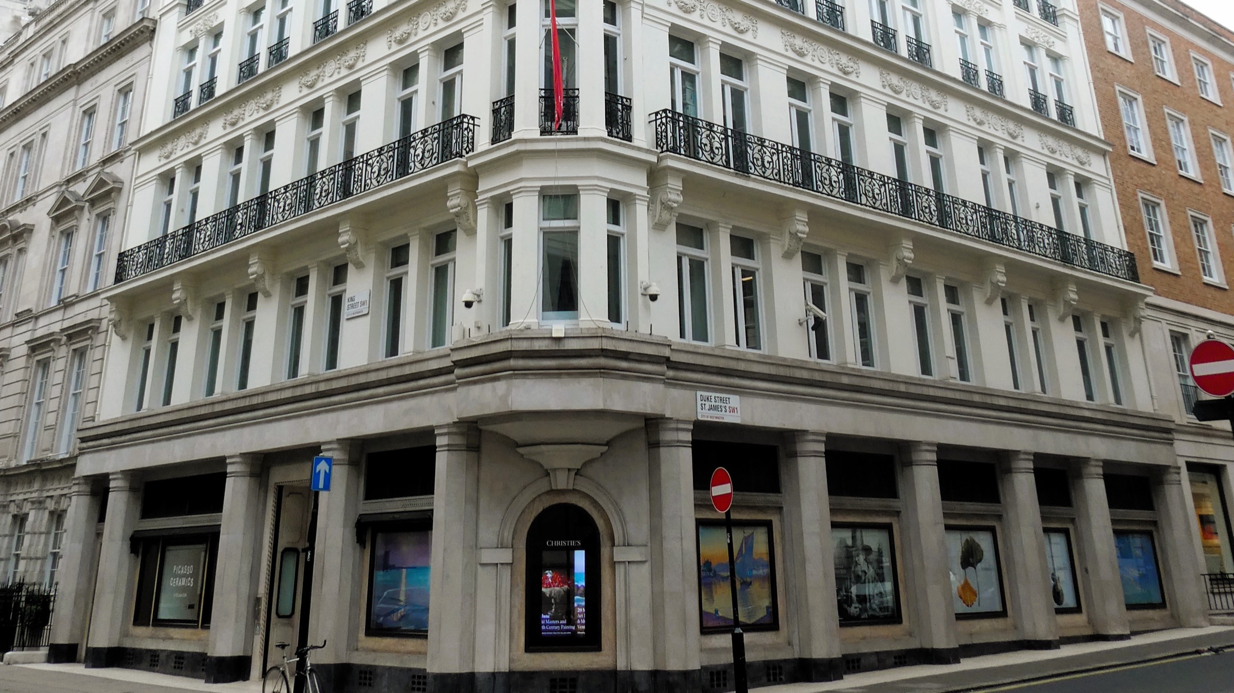 The white stone corner building of Christie's on King Street, St James's, with arched windows and a domed turret